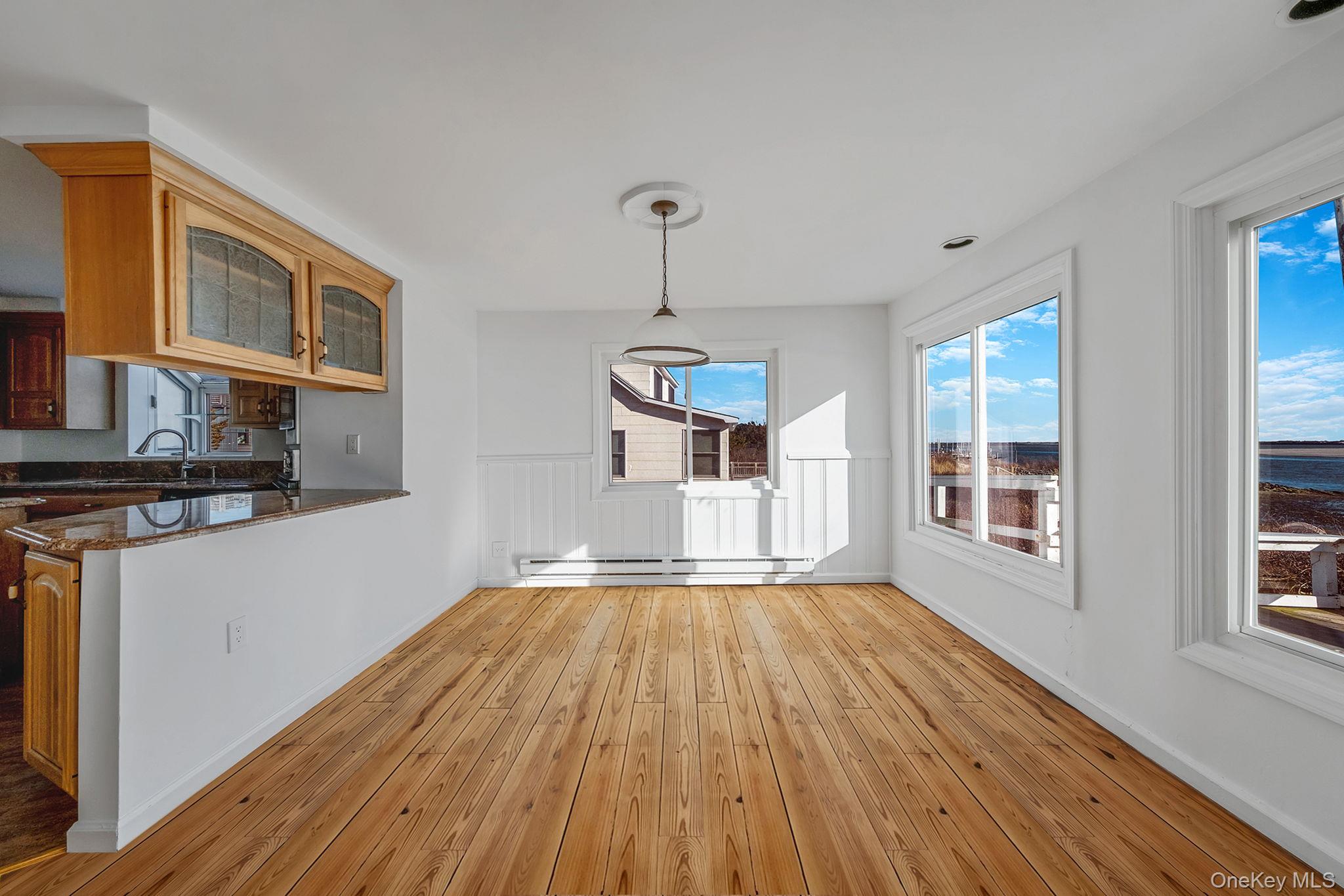 116 Oak Beach Road Babylon, NY 11702 - Photo 9 of 37 a view of a house with wooden floor and windows