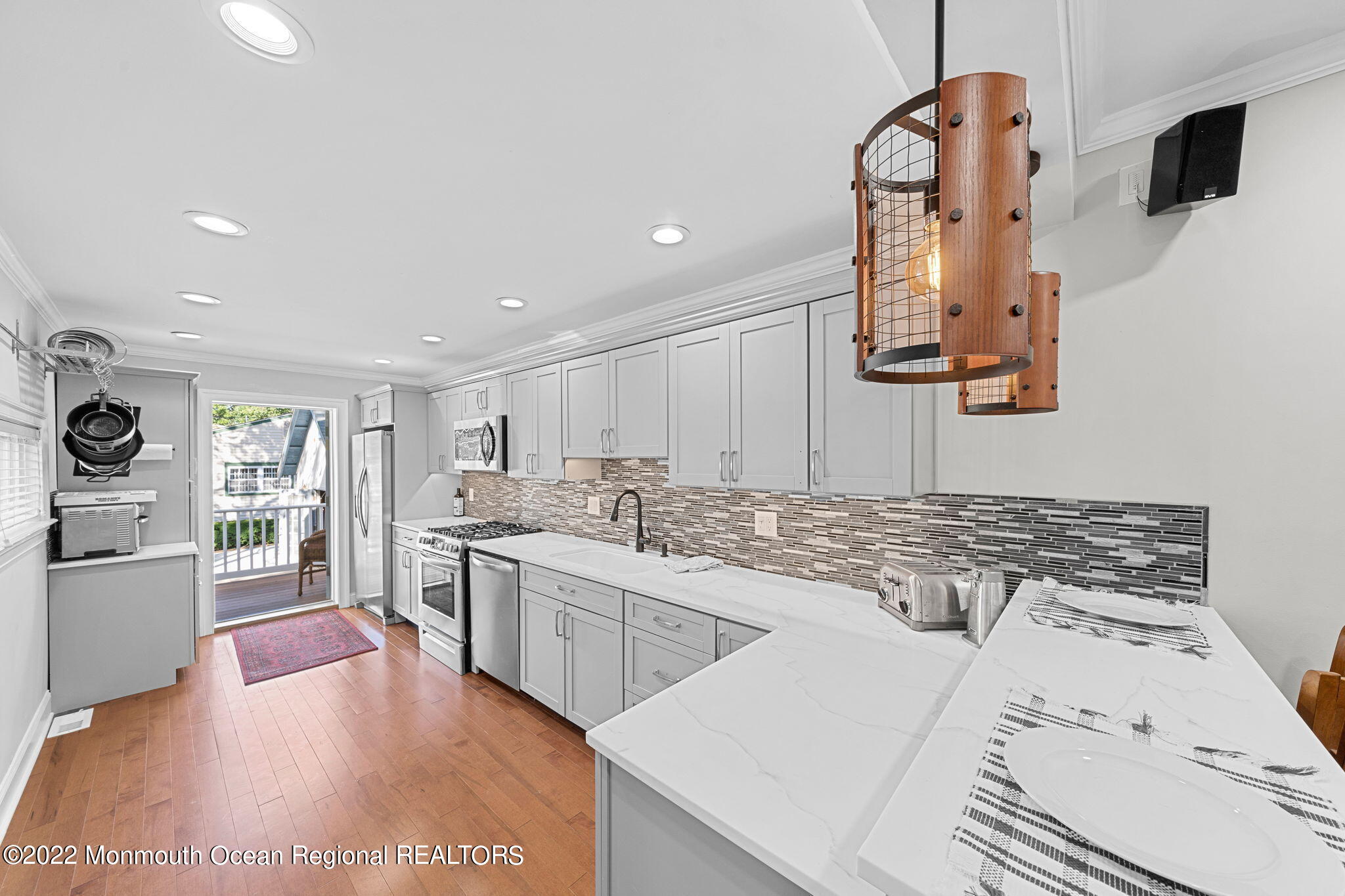 415 West New York Avenue, Unit 2 Somers Point, NJ 08244 - Photo 1 of 19 a kitchen with stainless steel appliances granite countertop a sink stove and refrigerator