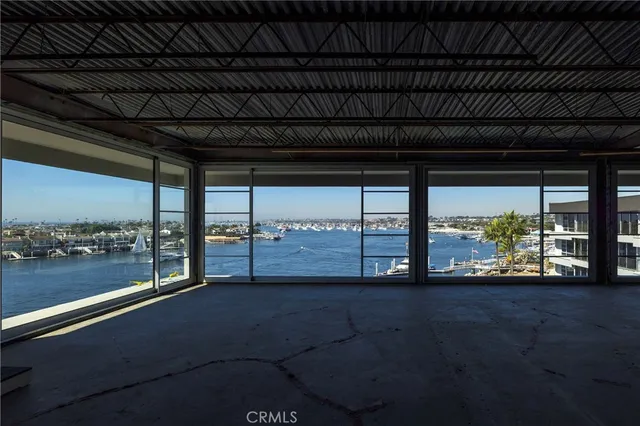 a view of an empty room with a balcony