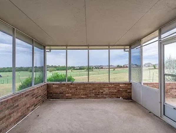a view of a back yard from a room