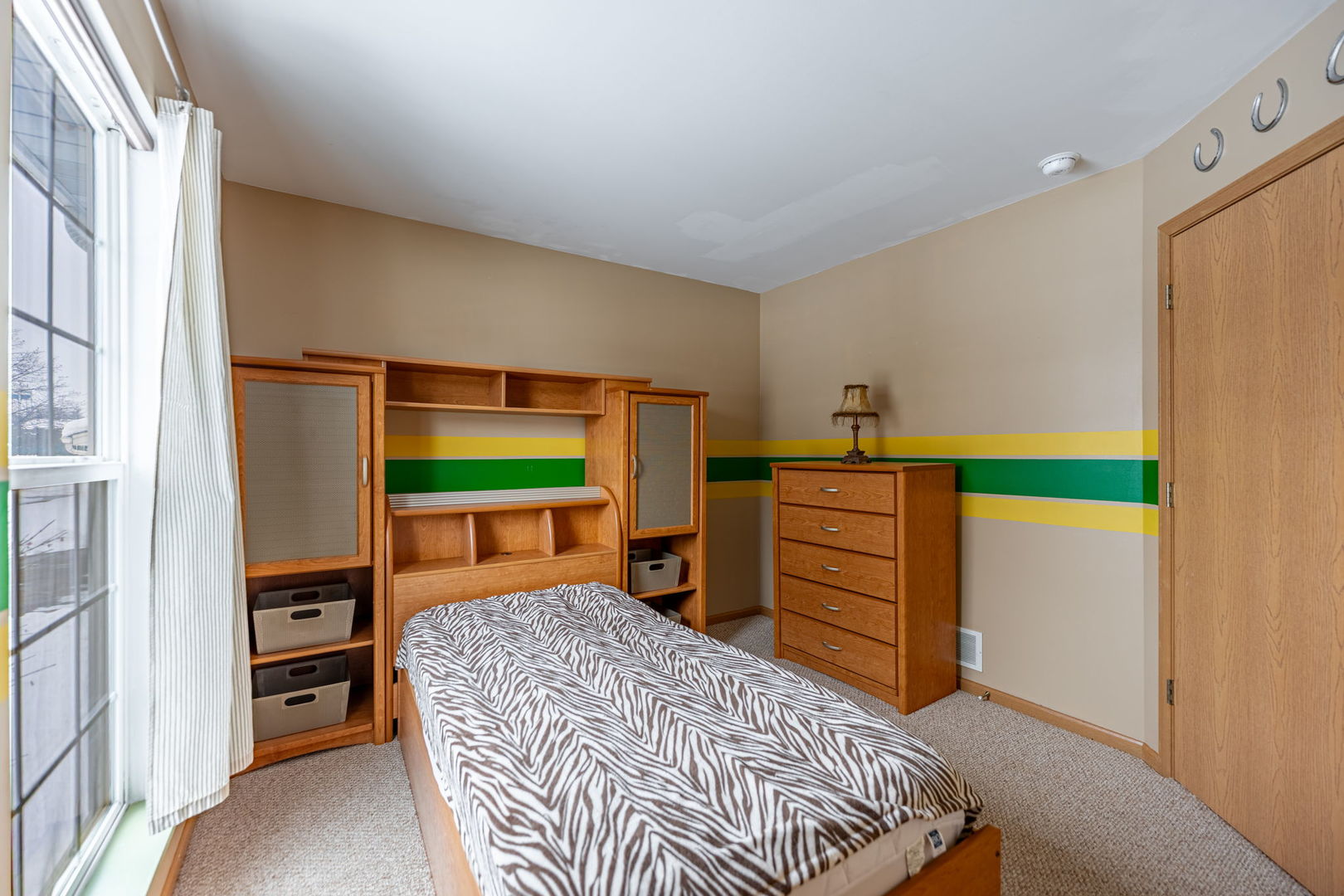 109 Shawnee Lane Harvard, IL 60033 - Photo 17 of 34 a bedroom with a bed and a closet