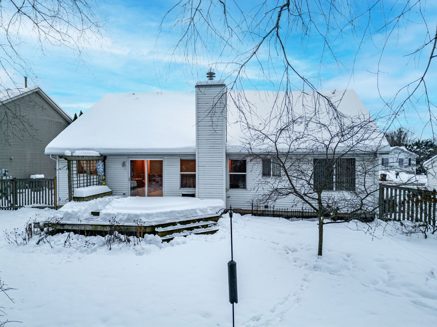 109 Shawnee Lane Harvard, IL 60033 - Photo 24 of 34 a view of a house with snow on the road