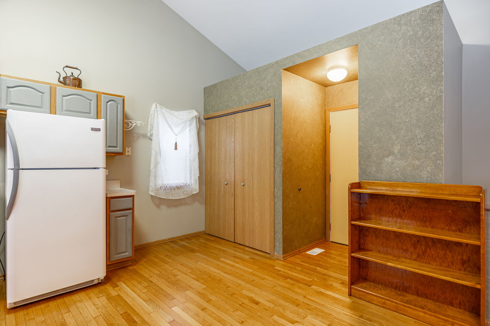 109 Shawnee Lane Harvard, IL 60033 - Photo 8 of 34 a view of room with a cabinet and a refrigerator