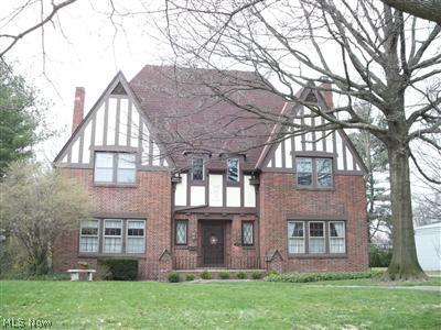 3048 Huntington Road Cleveland, OH 44120 - Photo 1 of 1 Charming Tudor with architectural details galore. The home has an attached 2 car garage.