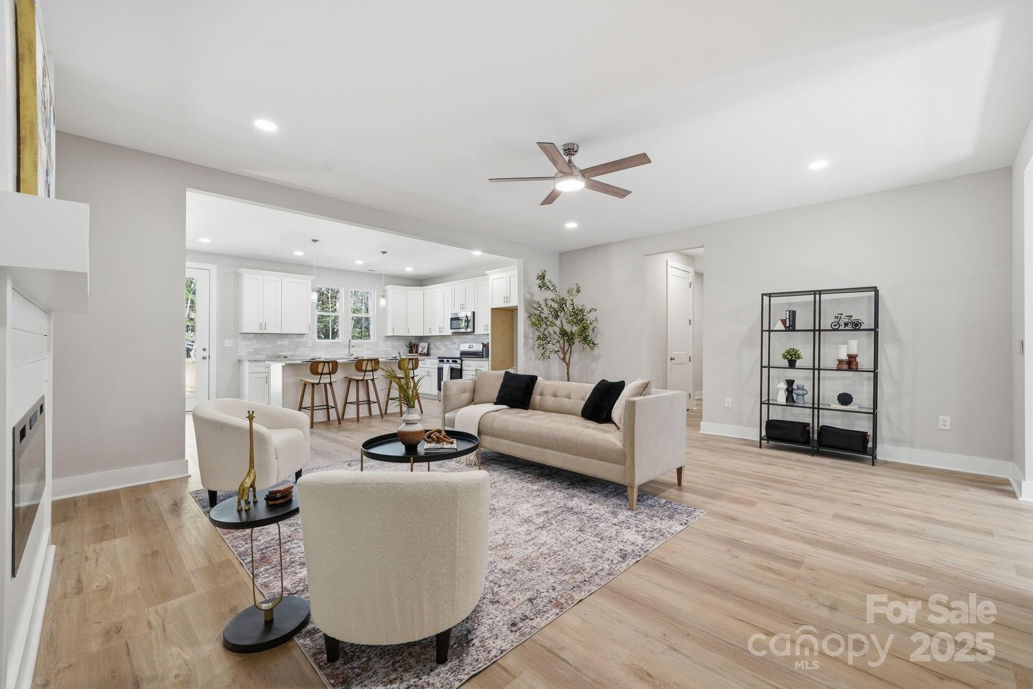 295 Mainsail Road Salisbury, NC 28146 - Photo 11 of 42 a living room with furniture and wooden floor