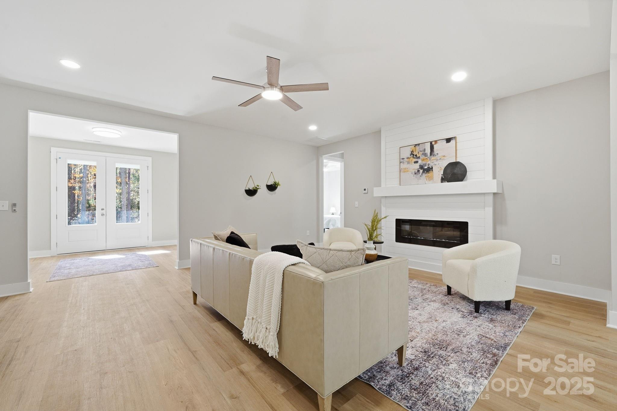 295 Mainsail Road Salisbury, NC 28146 - Photo 12 of 42 a living room with furniture and a fireplace