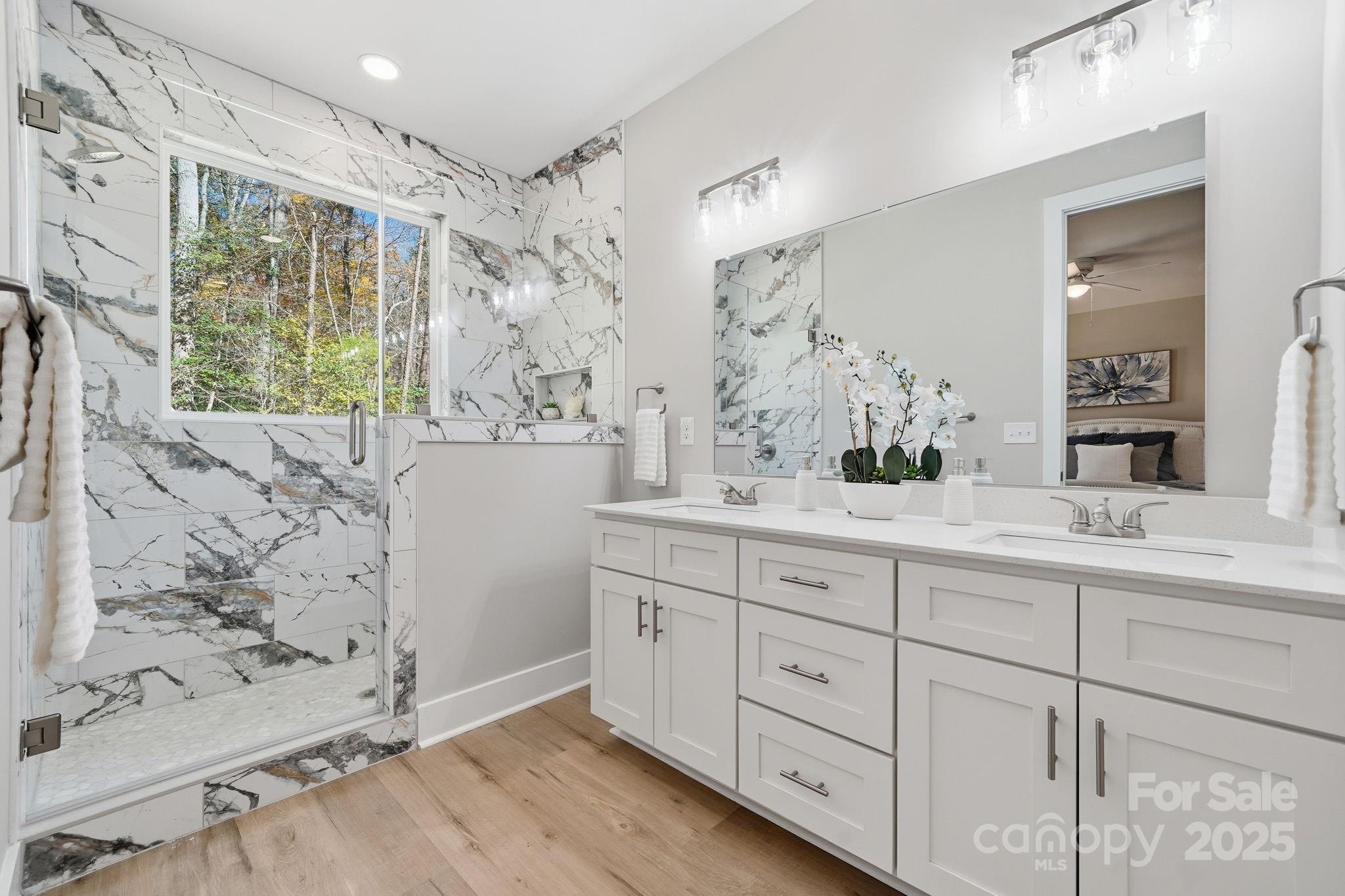 295 Mainsail Road Salisbury, NC 28146 - Photo 26 of 42 a bathroom with double vanity and a mirror