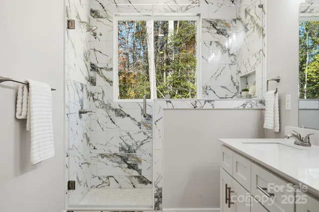 a bedroom with a bed and a chair