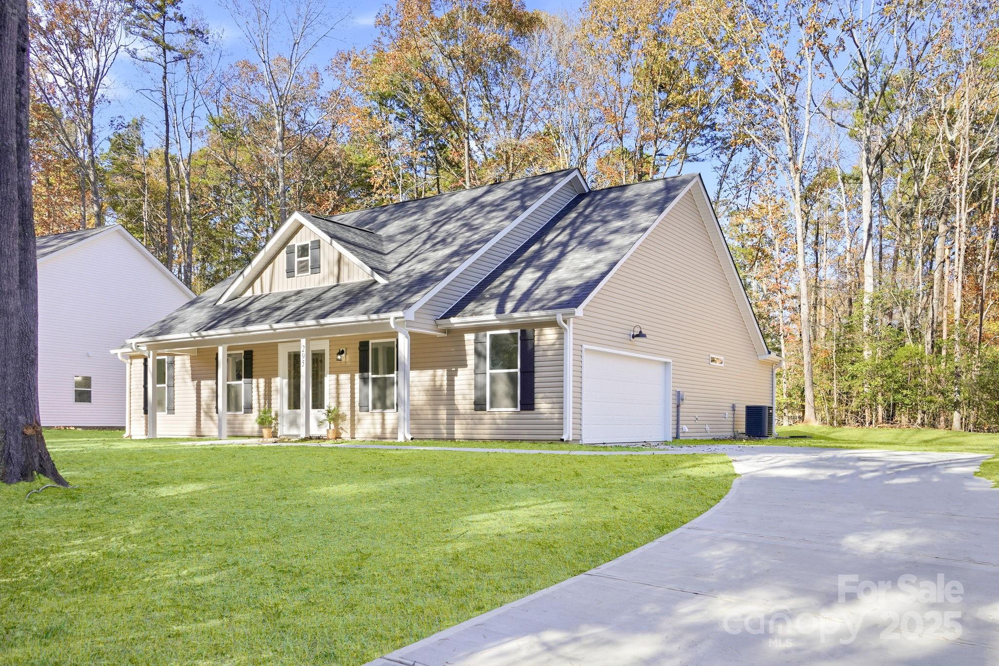 295 Mainsail Road Salisbury, NC 28146 - Photo 3 of 42 a front view of a house with a yard