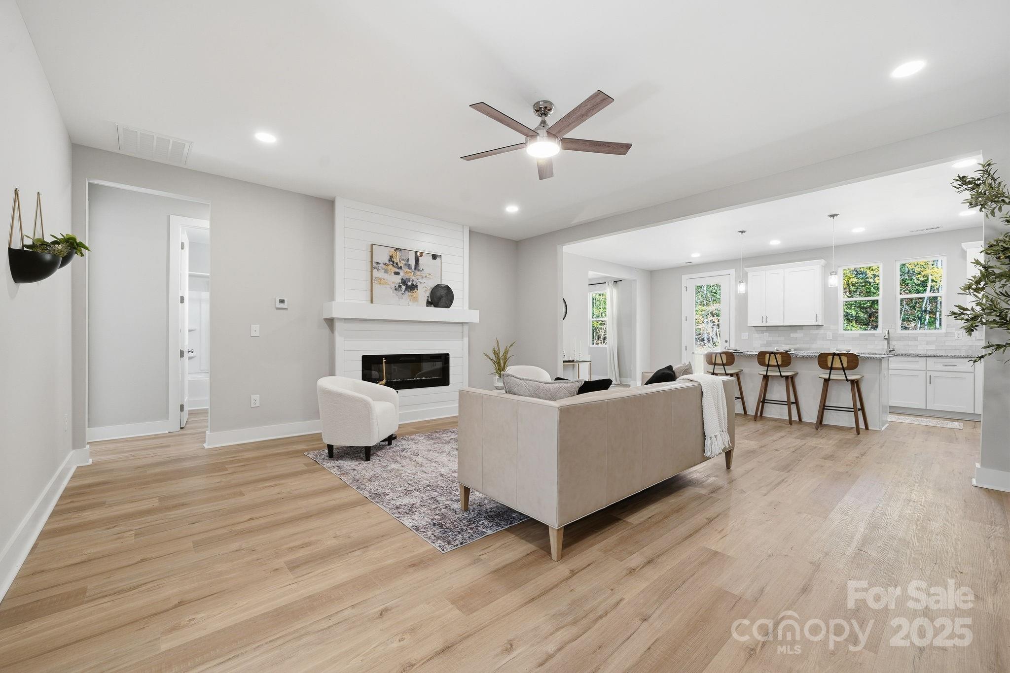 295 Mainsail Road Salisbury, NC 28146 - Photo 9 of 42 a living room with furniture and a fireplace
