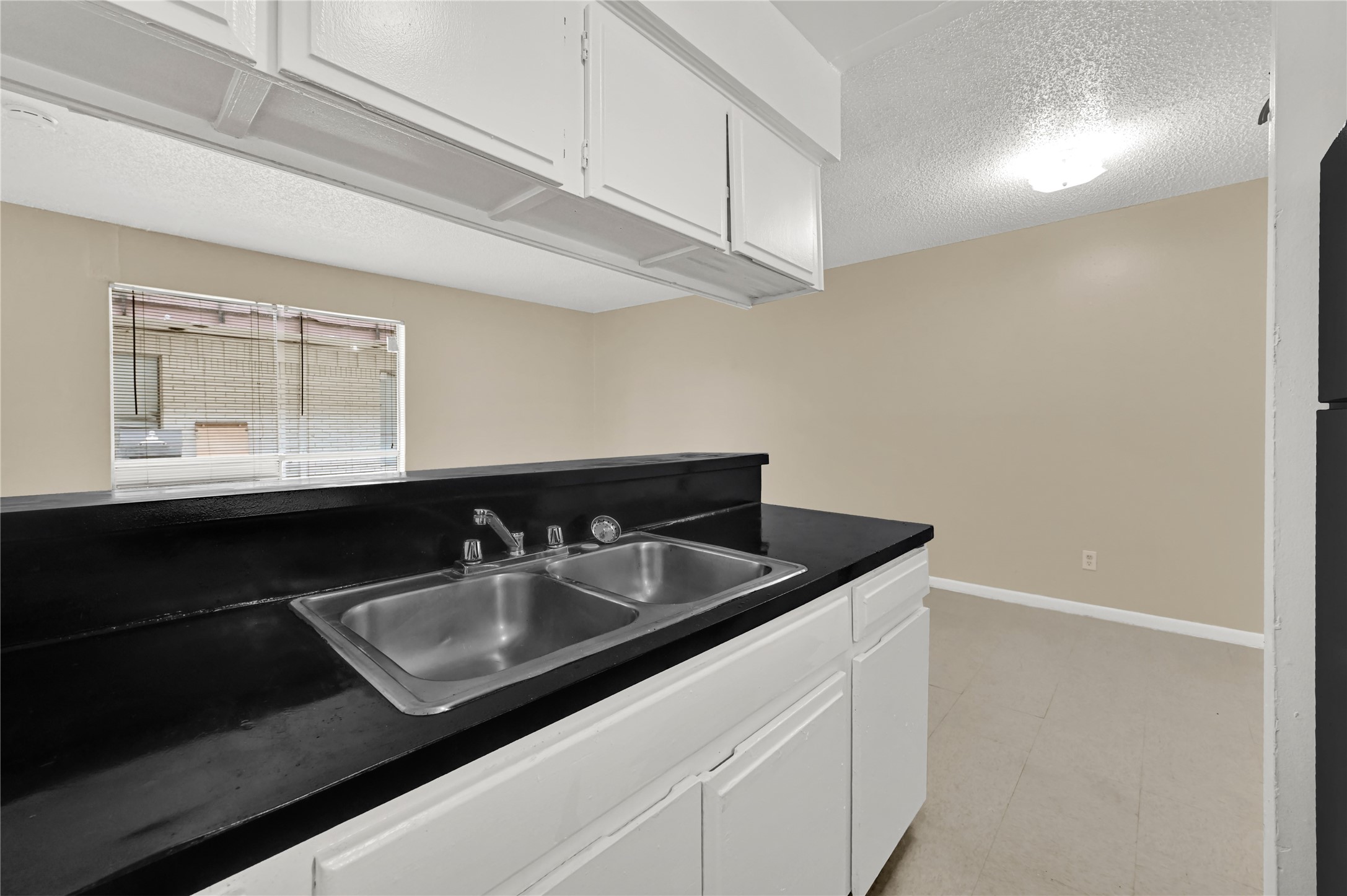 7211 Atwell Drive, Unit 16 Houston, TX 77081 - Photo 13 of 19 a bathroom with a sink and a mirror