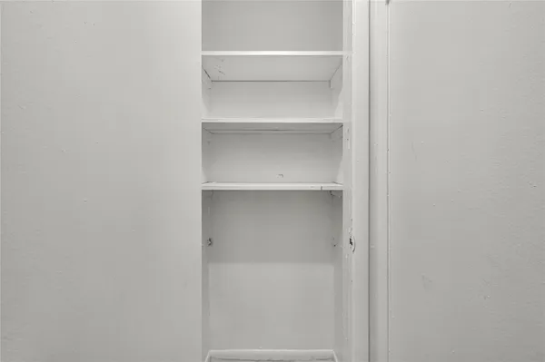 a view of an empty walk in closet