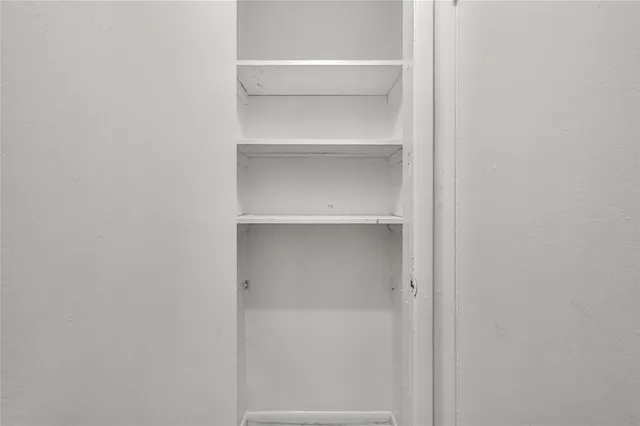 a view of an empty walk in closet