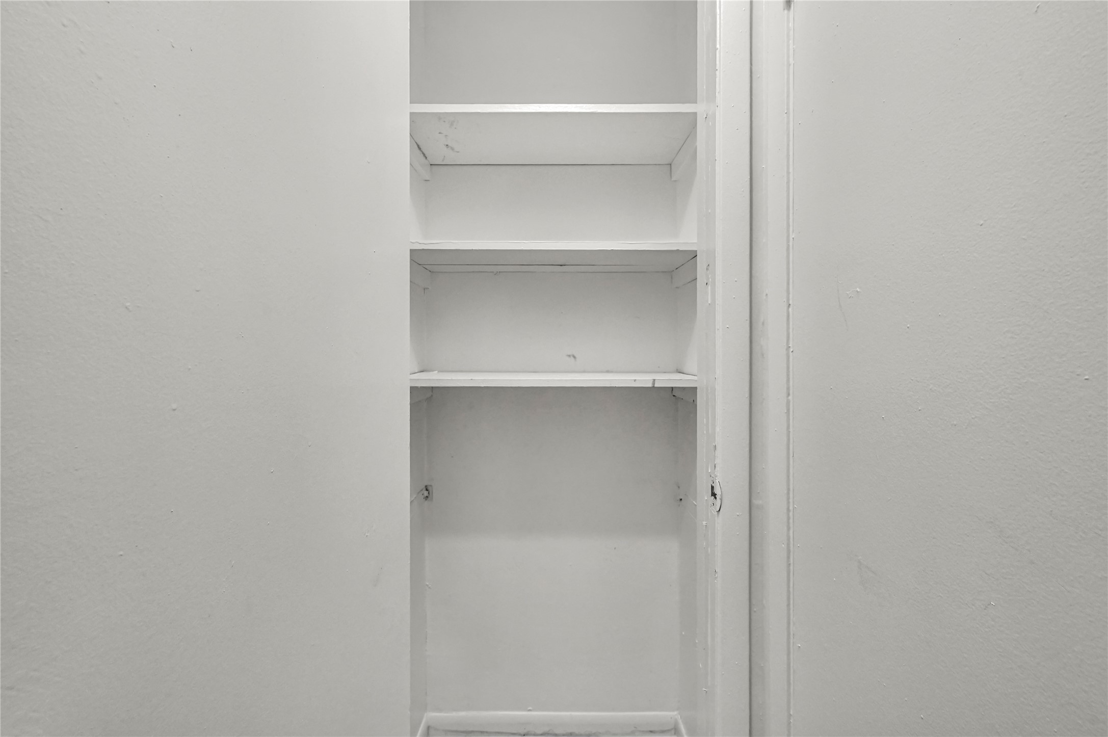 7211 Atwell Drive, Unit 16 Houston, TX 77081 - Photo 15 of 19 a view of an empty walk in closet