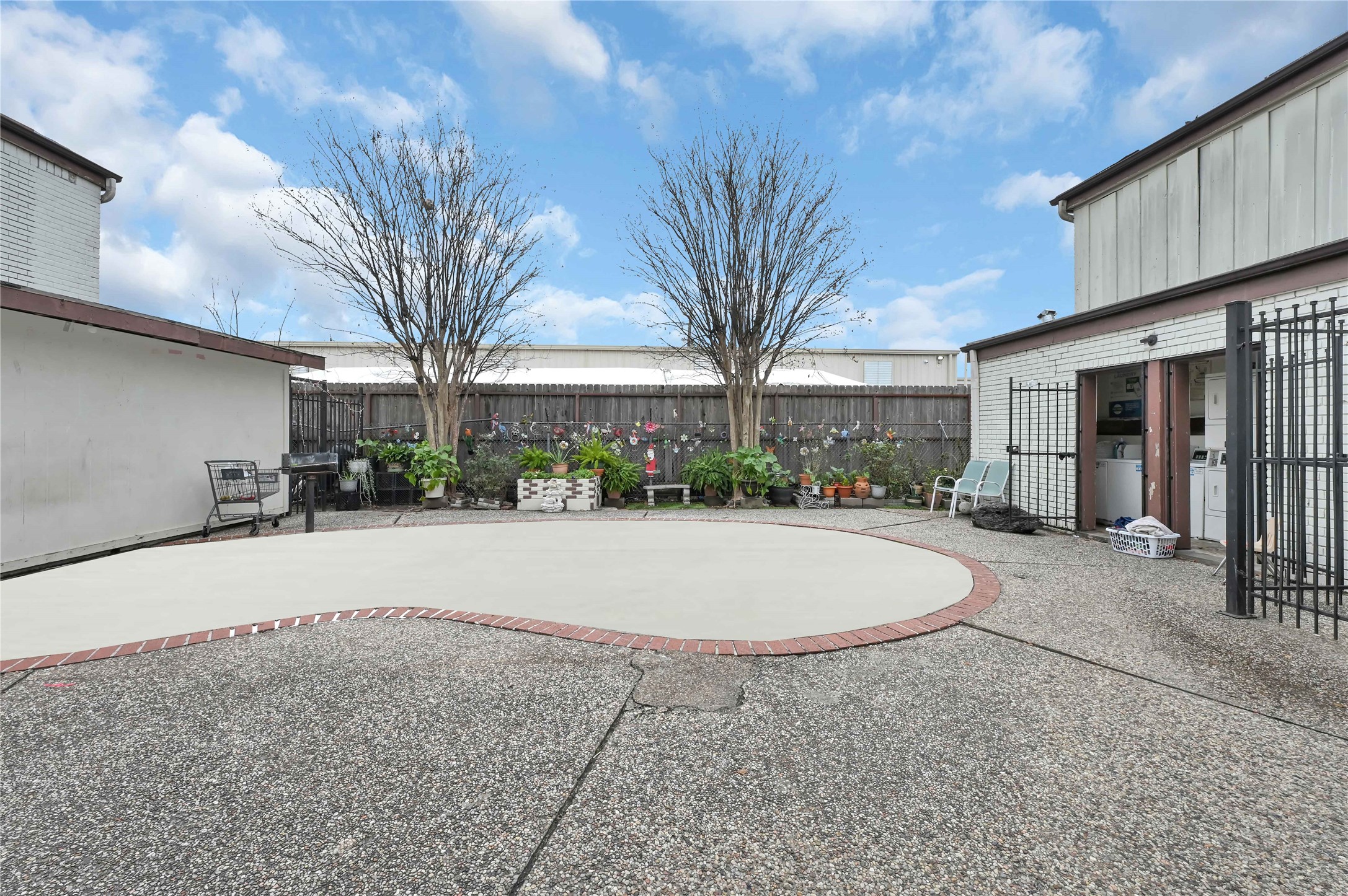 7211 Atwell Drive, Unit 16 Houston, TX 77081 - Photo 18 of 19 a house with palm tree in front of it