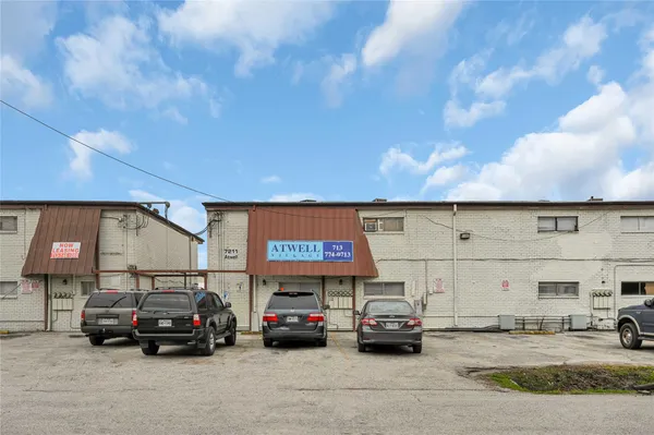 a view of parking with cars parked