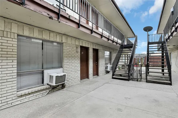 a view of an empty room with stairs