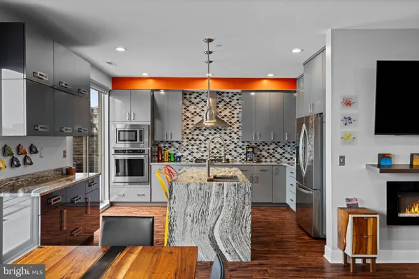 a living room with fireplace furniture and a flat screen tv