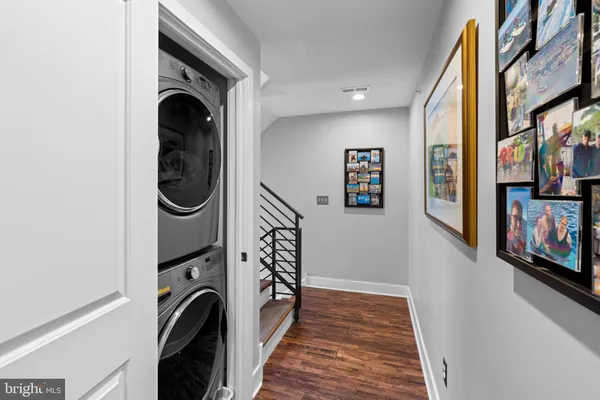 a view of a hallway with washer and dryer