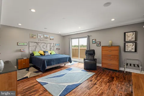 a bedroom with furniture and a book shelf