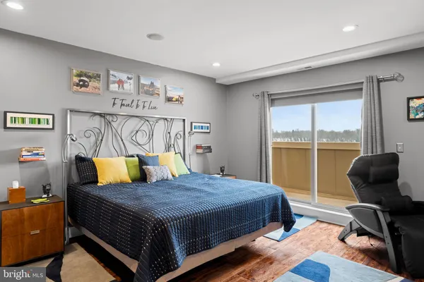 a bedroom with a bed and glass window