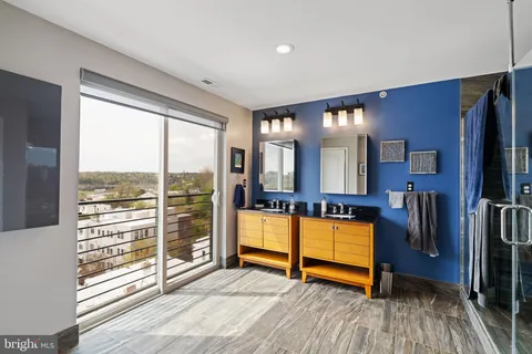 a view of a hallway with washer and dryer
