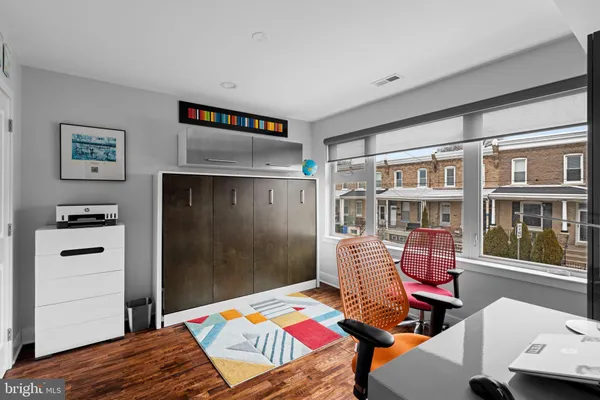 a bedroom with furniture and a book shelf