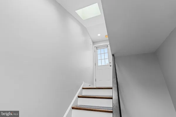 a view of entryway with wooden floor