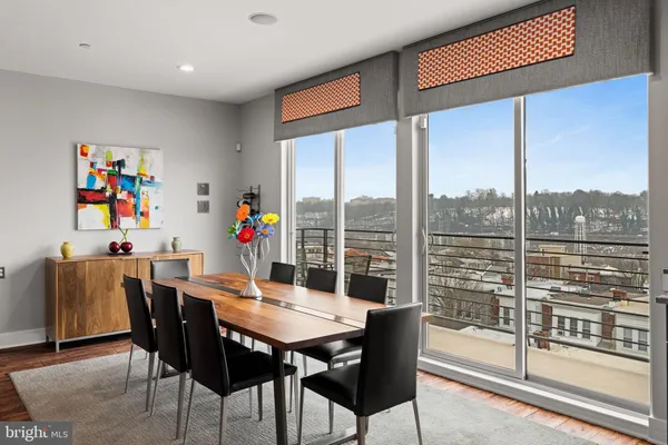 a view of a dining room with furniture window and outside view