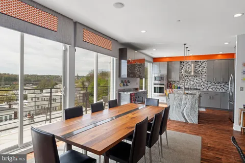 a view of a roof deck with furniture