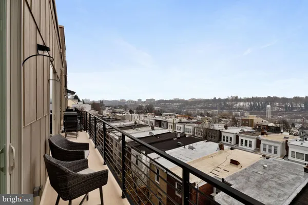 a view of a balcony with chairs