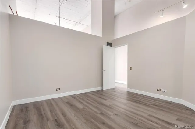 an empty room with wooden floor
