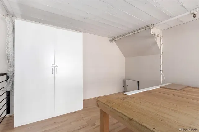 a bedroom with a bed and a shower