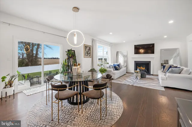 a view of kitchen with dining table and chairs