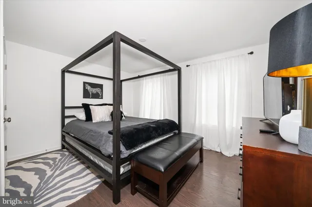 a bathroom with a sink toilet a mirror and shower