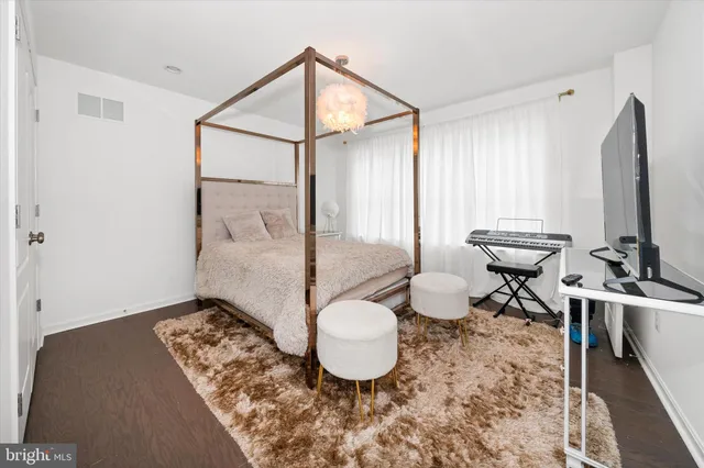 a living room with a couch and a dresser