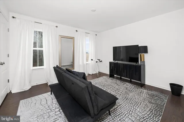 a view of a house with backyard sitting area and garden