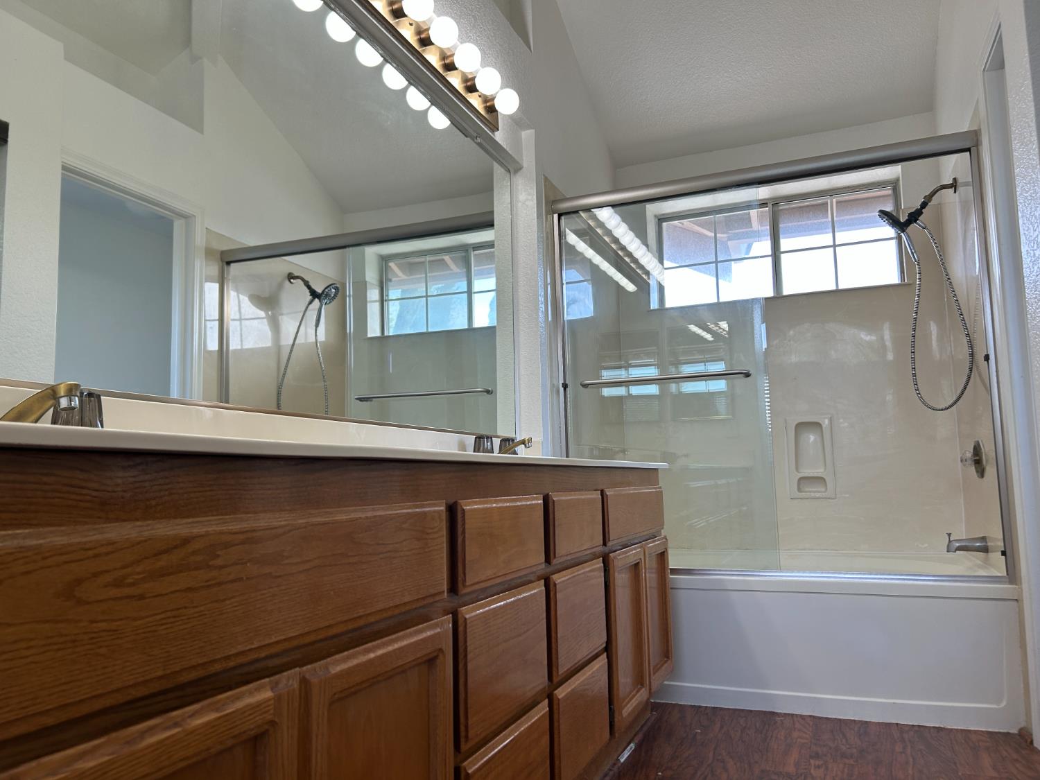 1981 West Kavanagh Avenue Tracy, CA 95376 - Photo 13 of 21 a bathroom with a sink a large mirror and a bathtub
