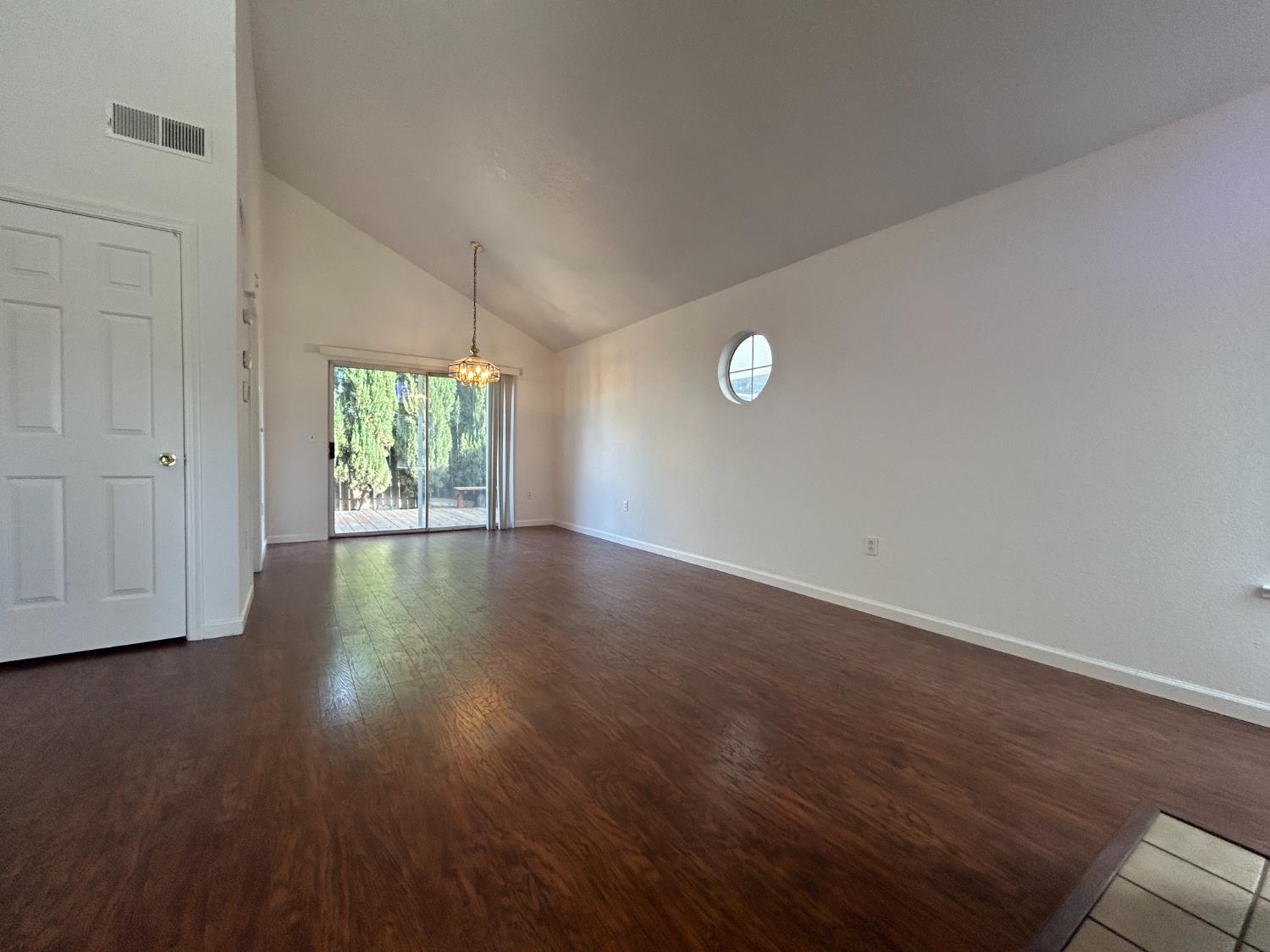 1981 West Kavanagh Avenue Tracy, CA 95376 - Photo 2 of 21 an empty room with wooden floor and windows