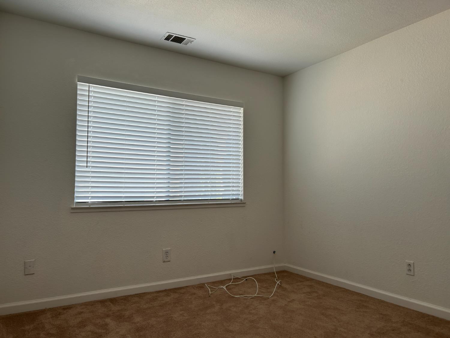 1981 West Kavanagh Avenue Tracy, CA 95376 - Photo 9 of 21 an empty room with a window