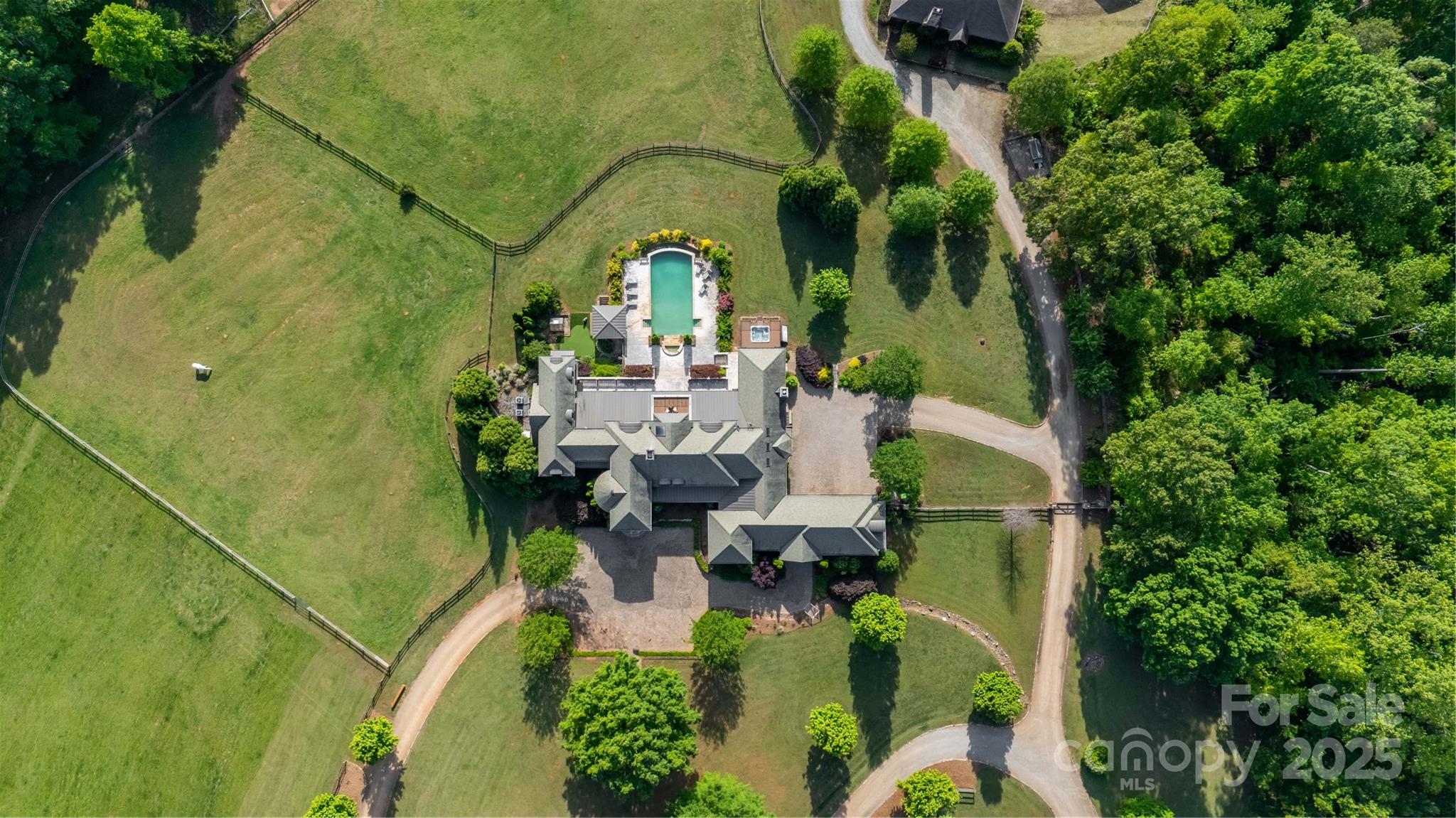 2921 North Pacolet Road Landrum, SC 29356 - Photo 35 of 37 an aerial view of a house with swimming pool and garden