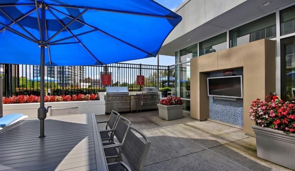 2171 Peachtree Road, Unit 1403 Atlanta, GA 30309 - Photo 14 of 25 a outdoor space with lots of table and chairs