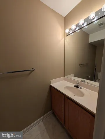 a bathroom with a sink and mirror