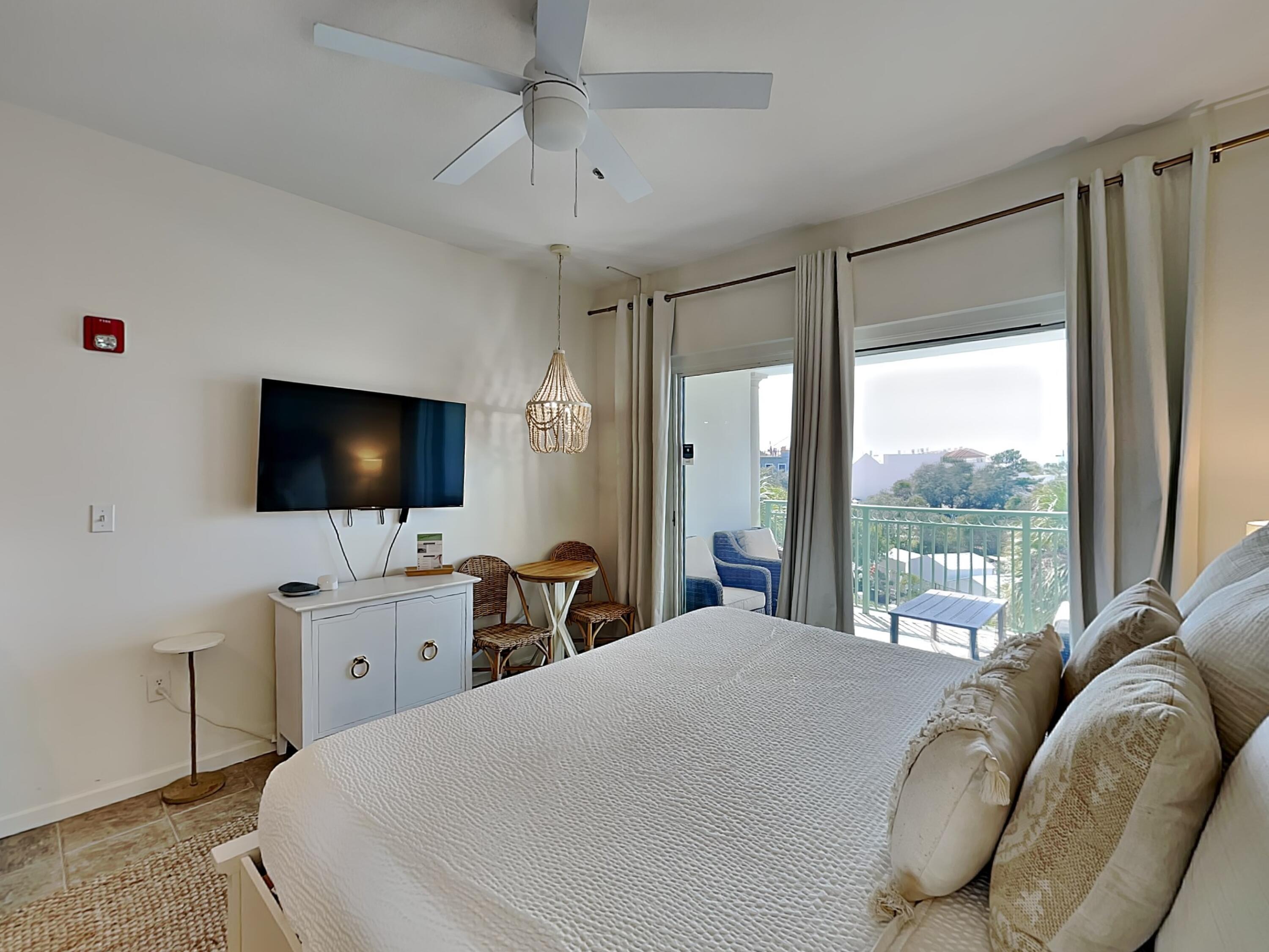 9955 East County Highway 30A, Unit 303 Inlet Beach, FL 32461 - Photo 6 of 17 a bedroom with a bed and a flat screen tv on the dresser