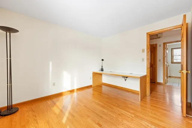 a view of an empty room with windows