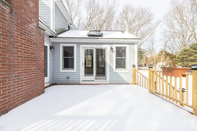 a view of a brick house with a large window