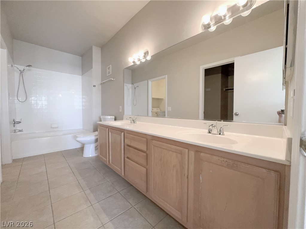 8725 West Flamingo Road, Unit 208 Las Vegas, NV 89147 - Photo 7 of 16 This spacious primary bathroom features a dual vanity and a combination tub and shower for comfort.