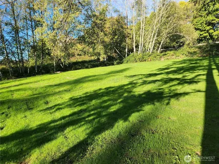 a view of a golf course with a yard