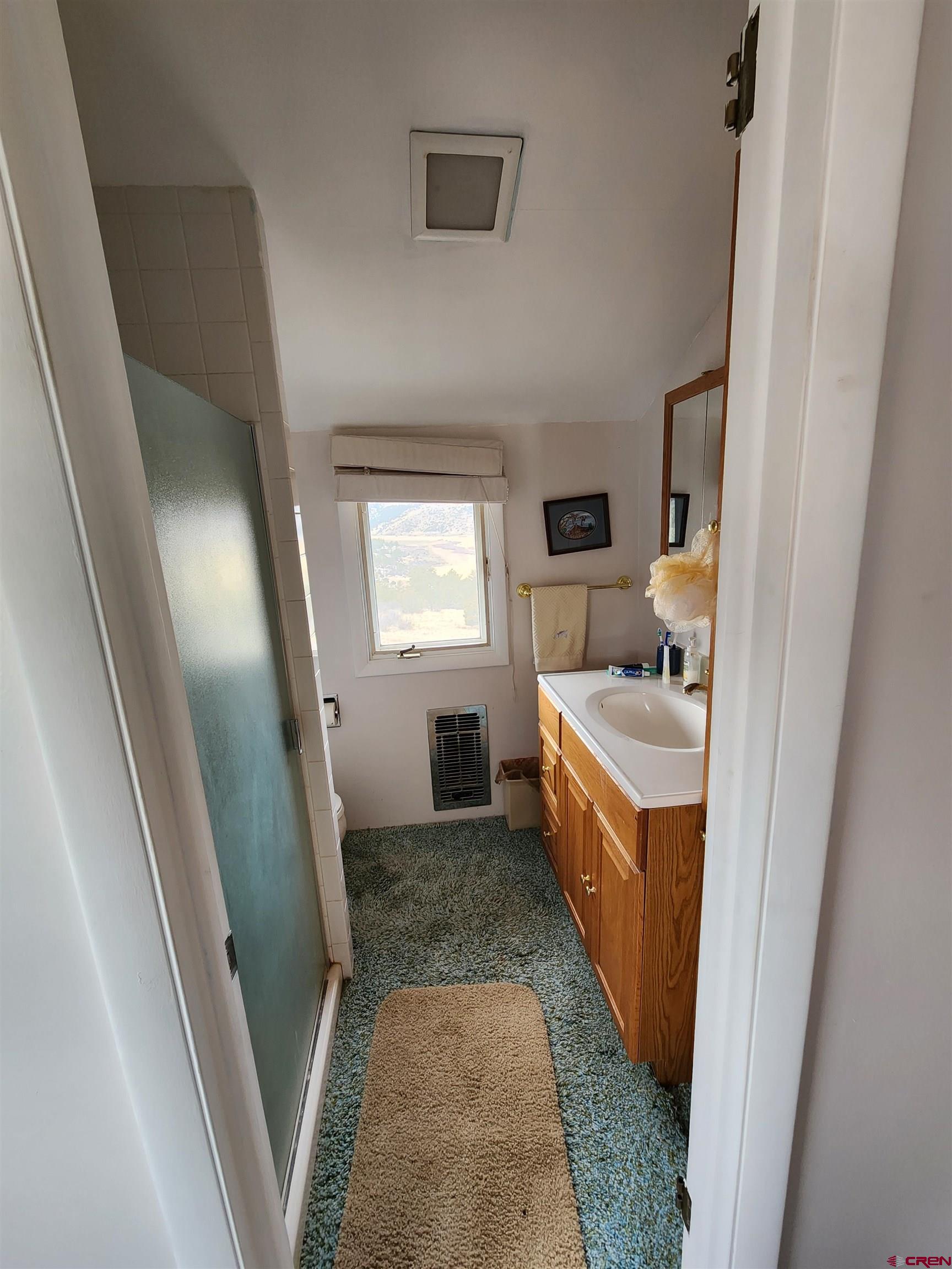 Tbd County Rd LL56 Villa Grove, CO 81155 - Photo 15 of 24 a bathroom with a sink a washer and dryer
