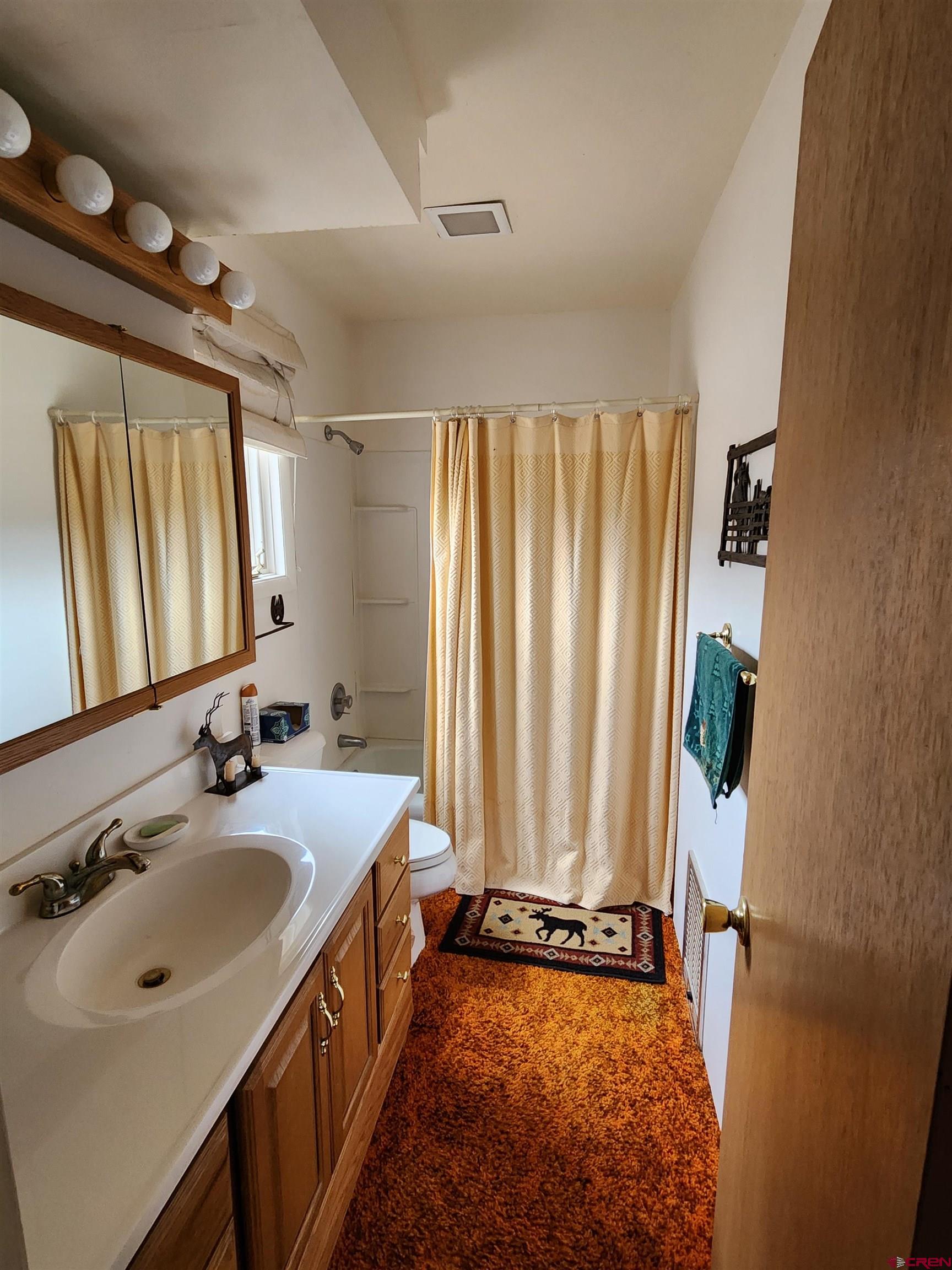 Tbd County Rd LL56 Villa Grove, CO 81155 - Photo 16 of 24 a bathroom with a tub sink and mirror